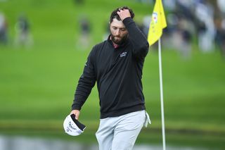 Rahm runs his hands through his hair following his final round 74