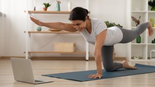 Woman performs quadruped exercise