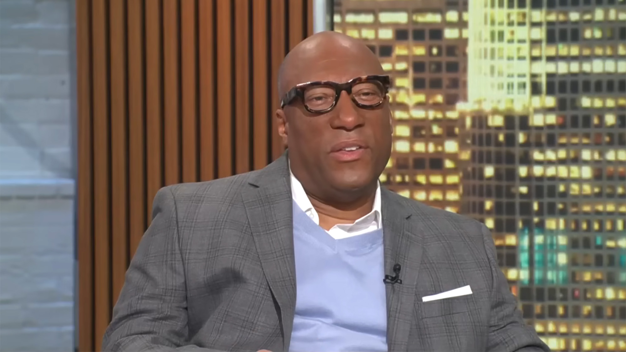 Byron Allen in a suit and sweater talks opening on CBS on CBS Mornings.