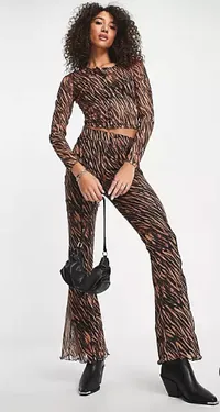 Get the Set:
$27 Mesh Crop Top In Tiger Print at ASOS
$33 Mesh Wide Leg Pants In Tiger Print at ASOS