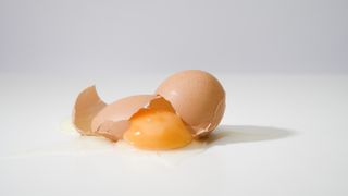 Shown here, a cracked egg. This is not a reversible process, according to the second law of thermodynamics.