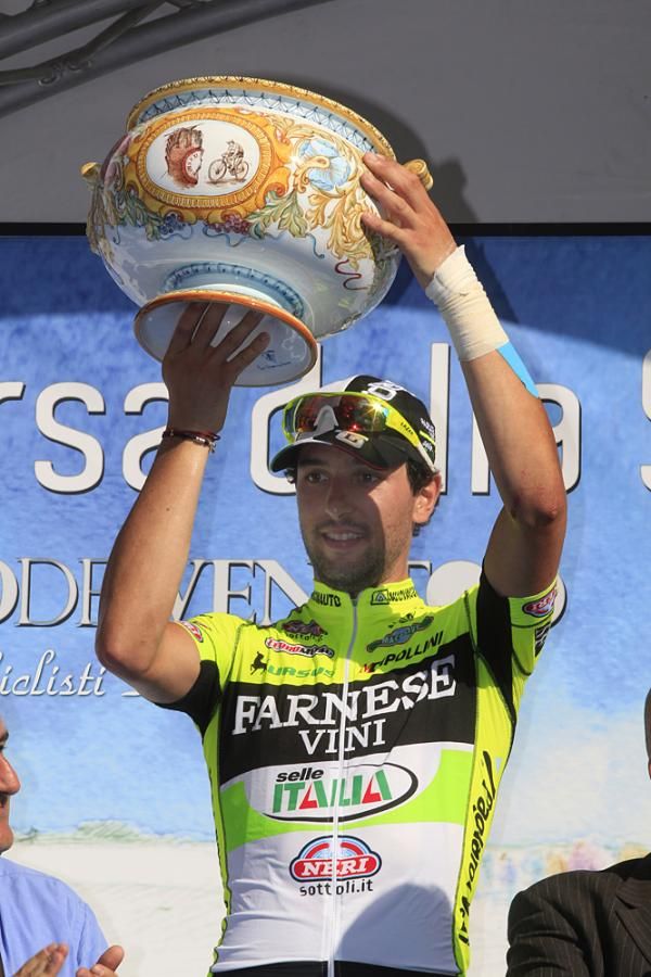Oscar Gatto hoists his trophy for the Giro del Veneto win