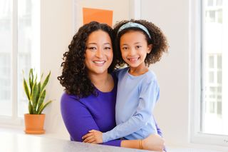 Denise Woodard, founder of Partake Foods, with her daughter, who inspired her to launch the company.