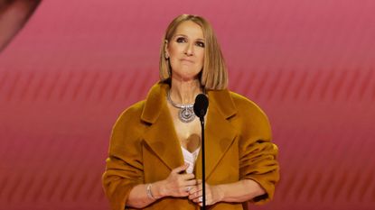 Celine Dion speaks onstage at the 2024 Grammy Awards