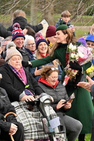 Kate Middleton wears a green coat and hat to meet royal fans outside St Mary Magdalene church in Sandringham on Christmas Day