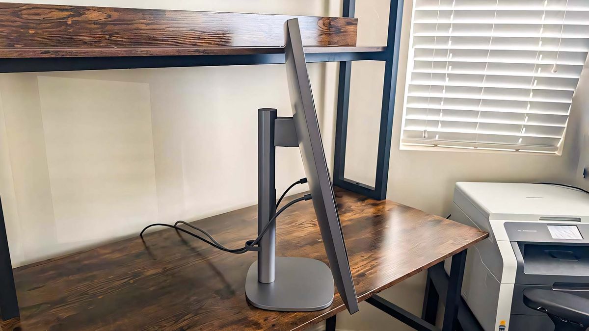 Profile view of HP OmniStudio X AIO with the monitor tilted up.