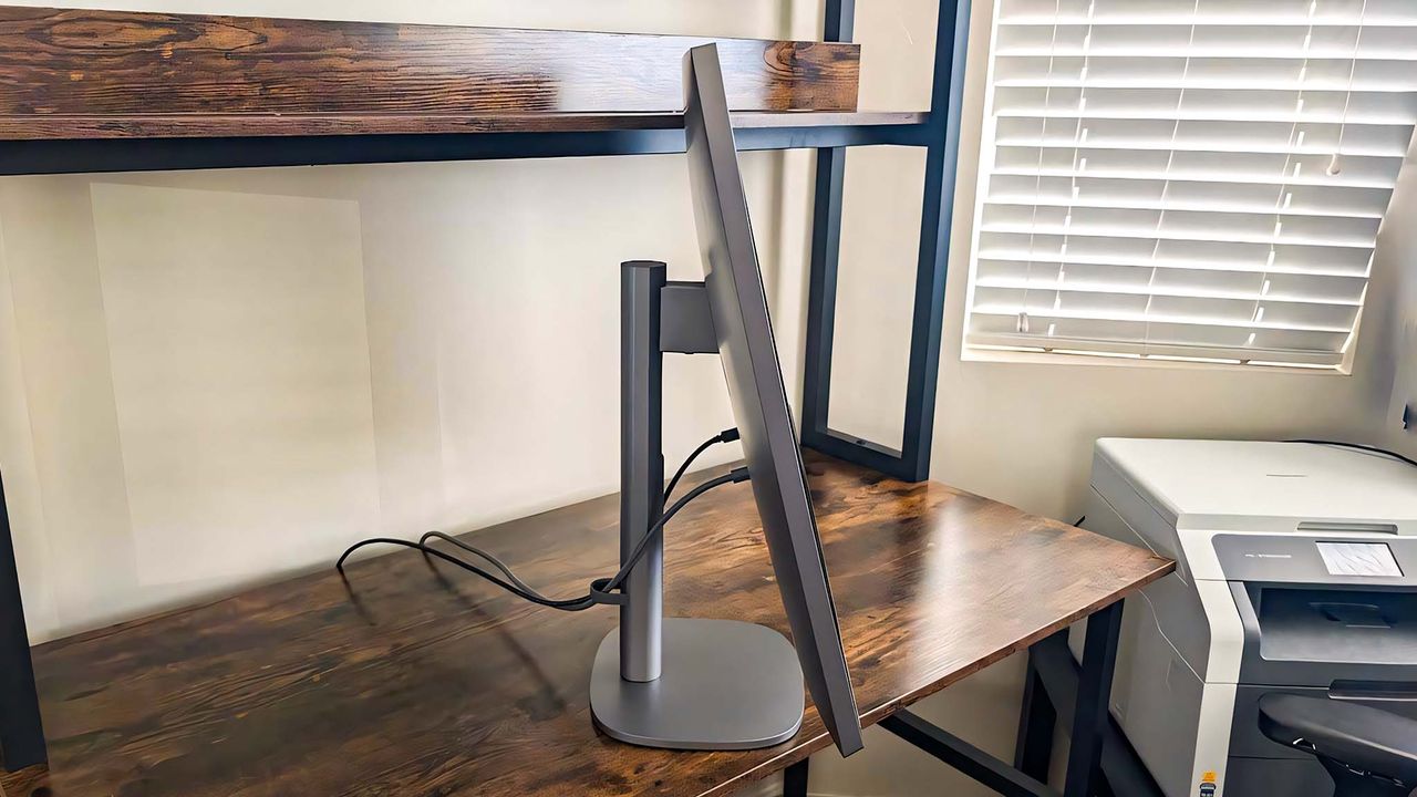 Profile view of HP OmniStudio X AIO with the monitor tilted up.