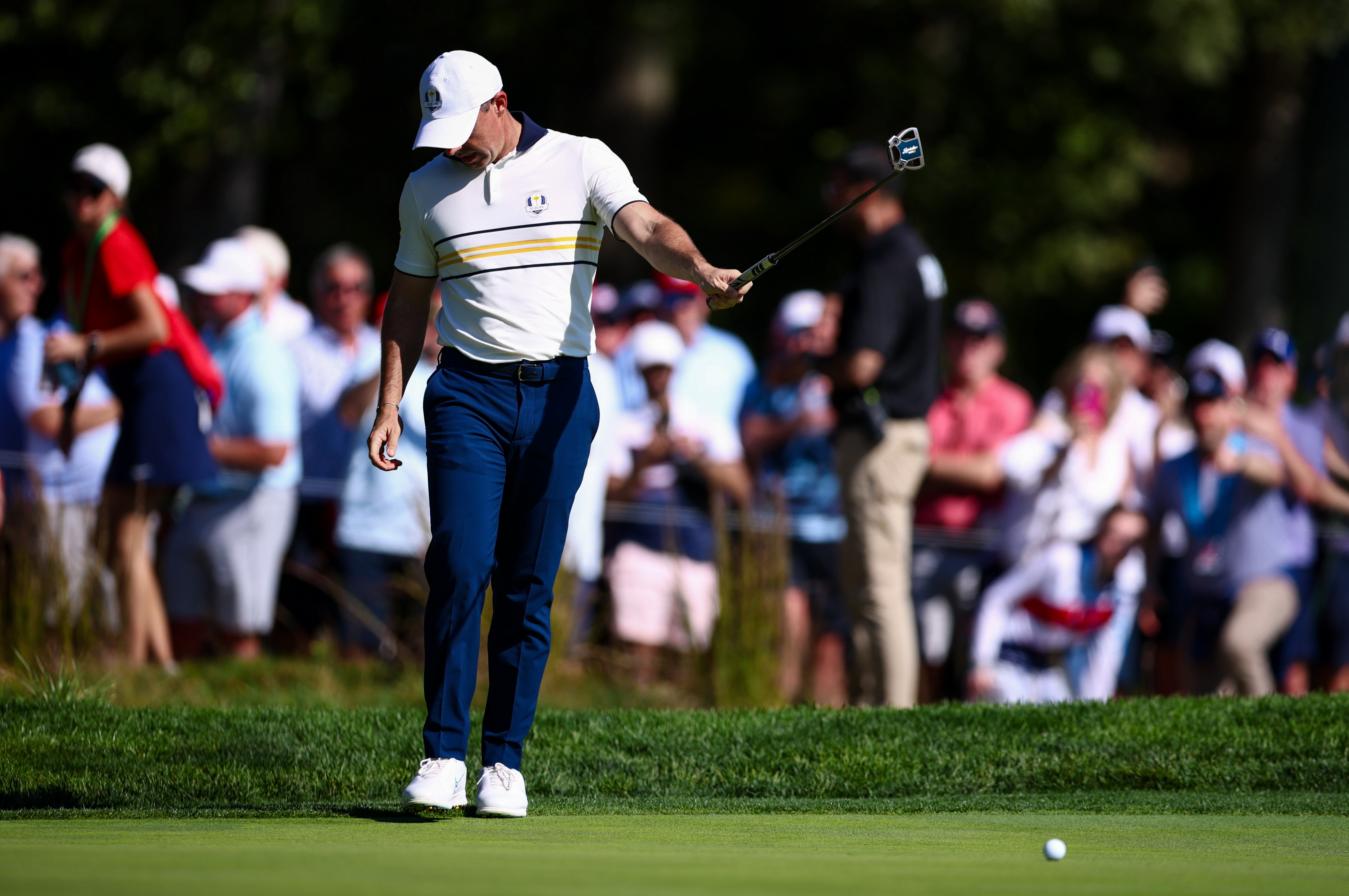 Rory Points a putt in