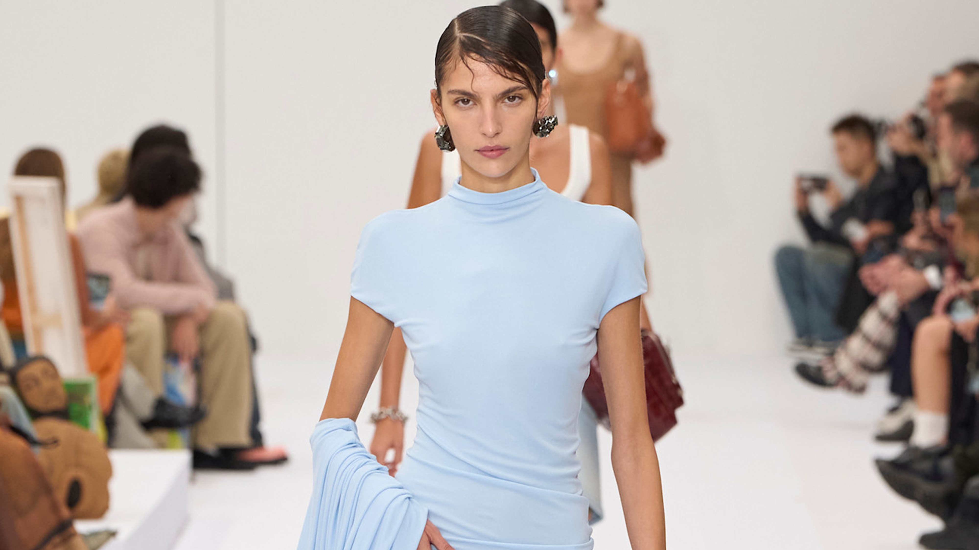 Model wears the baby blue color trend on the runway.