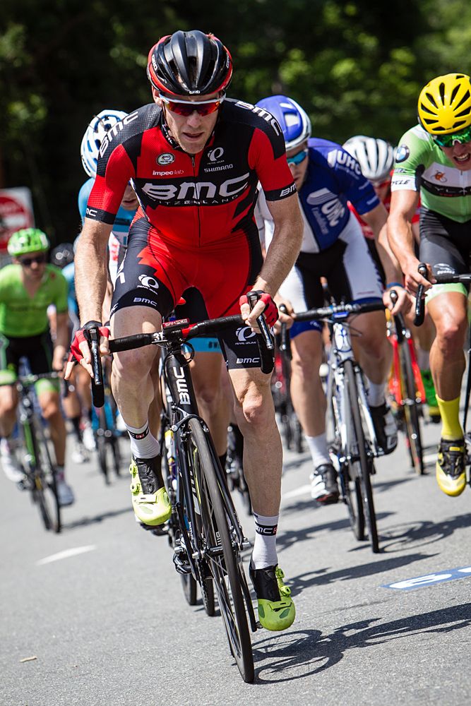 Brent Bookwalter (BMC) rides at the front of the bunch.