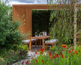 pergola at 'The Viking Friluftsliv Garden', Designed by Will Williams at RHS Hampton Court Palace Garden Festival 2021
