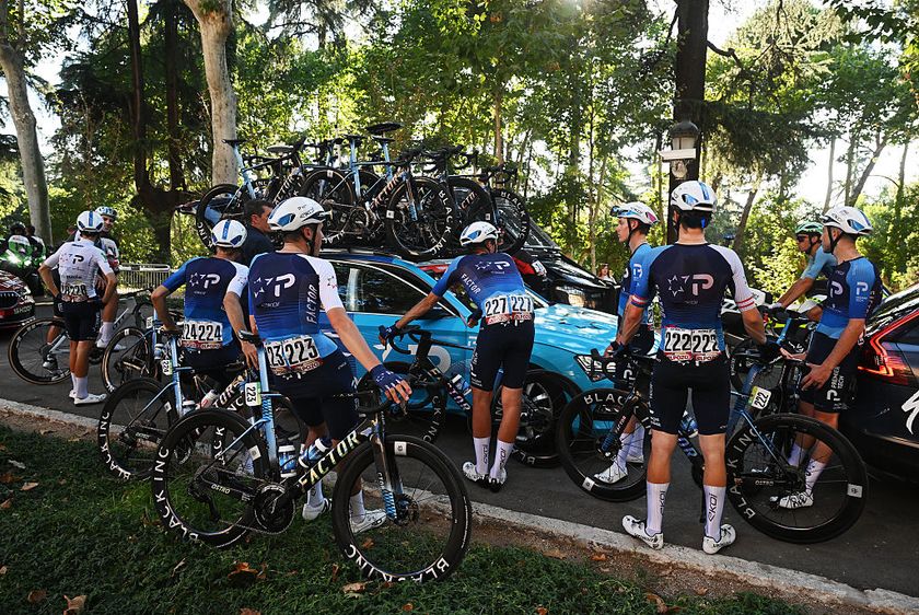 MADRID, SPAIN - SEPTEMBER 14: Pierre-Andre Cote of Canada, Marco Frigo of Italy, Jan Hirt of Czech Republic, Nadav Raisberg of Israel, Jake Stewart of Great Britain, Ethan Vernon of Great Britain, Matthew Riccitello of The United States - White Best Young Rider Jersey and Team Israel - Premier Tech is at a standstill due to the pro-Palestinian protests in the city of Madrid during the La Vuelta - 80th Tour of Spain 2025, Stage 21 a 108km stage from Alalpardo to Madrid / The race is neutralised due to disturbances in central Madrid caused by pro-Palestinian protests / #UCIWT / on September 14, 2025 in Madrid, Spain. (Photo by Dario Belingheri/Getty Images)