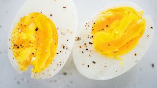 Two halves of a boiled egg, one of the best high-protein low-calorie foods
