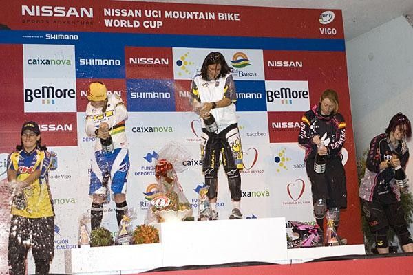 Women on the podium celebrate.
