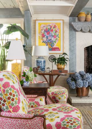 colourful floral upholstered armchairs in French style room
