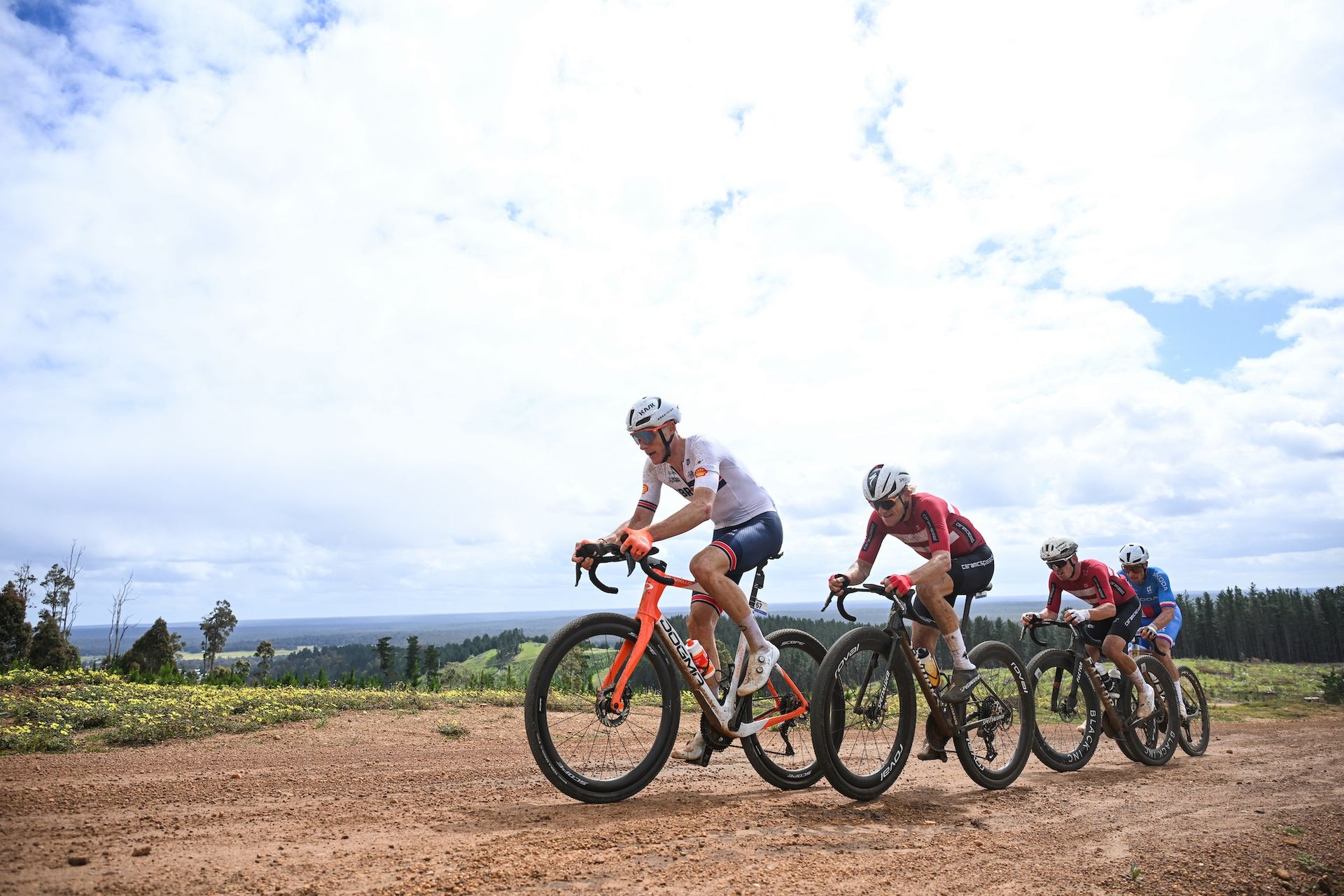 The final group of four at the UCI Gravel World Championships, Connor Swift (Great Britain), Mads Würtz Schmidt (Denmark), Magnus Bak Klaris (Denmark) and Florian Vermeersch (Belgium)