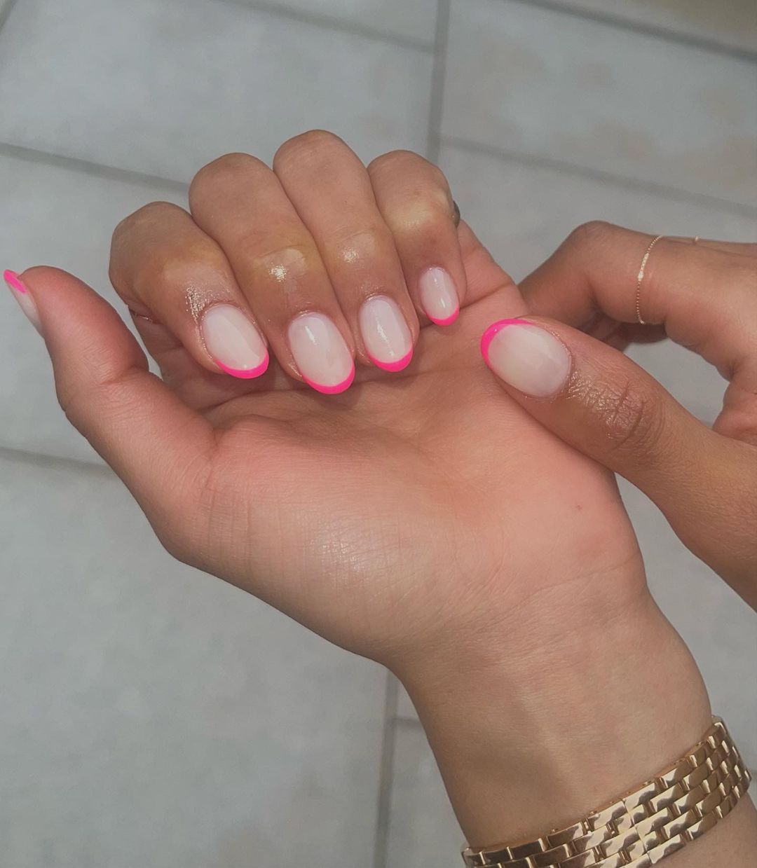 Neon pink French tip nails