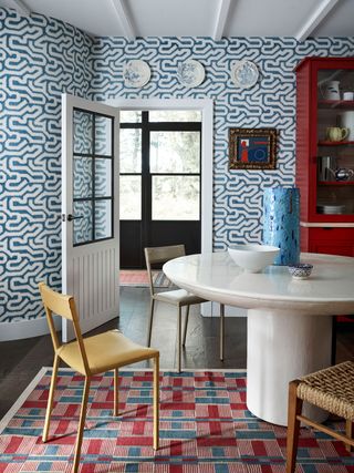 Dining room with wallpapered walls
