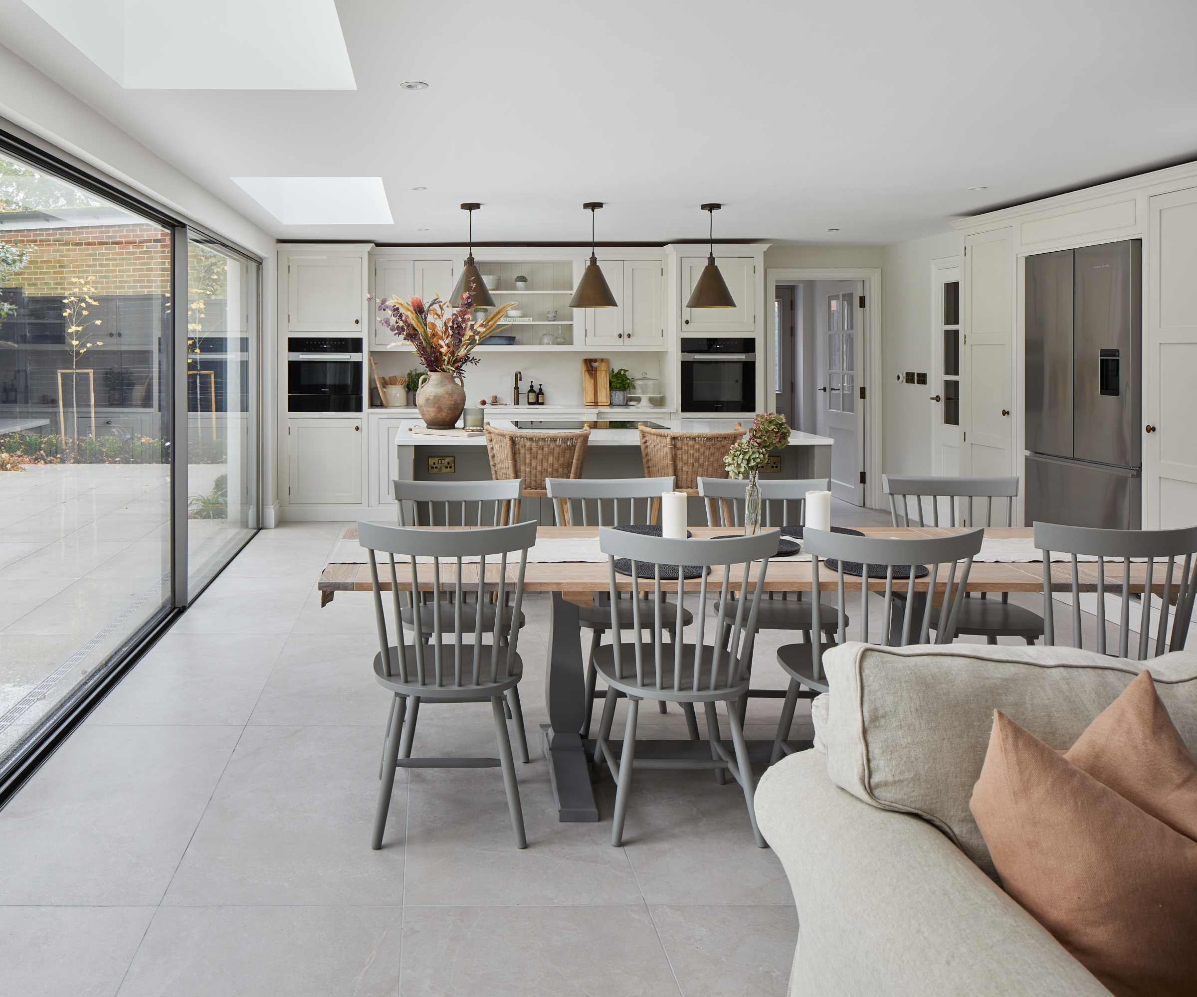 open plan kitchen, living and dining space in soft netural colour palette