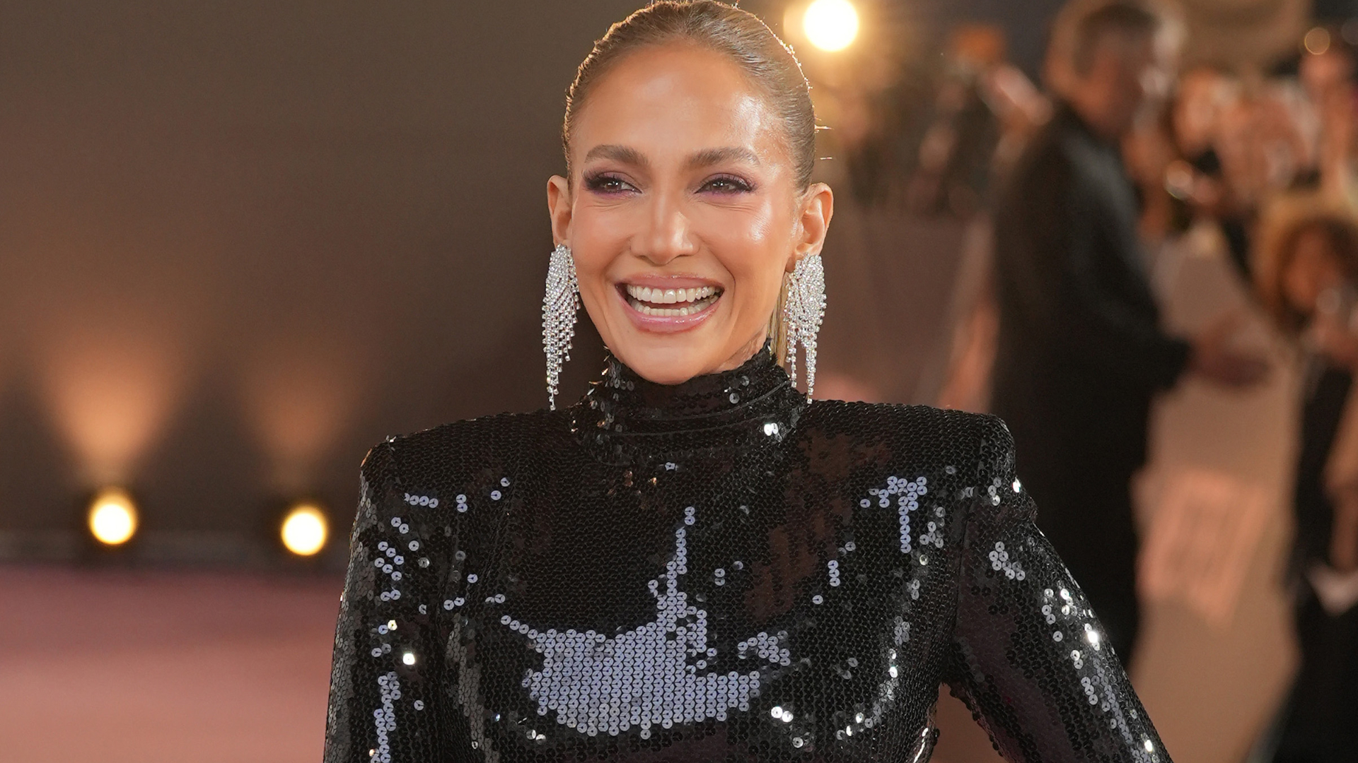 Jennifer Lopez wore a black sequin gown with a neon pink skirt at the Office Romance premiere in London