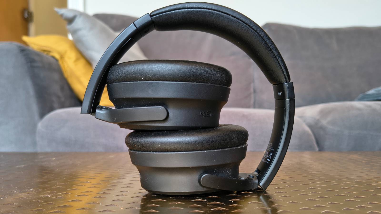 The Earfun Tune Pro atop a bronze table.