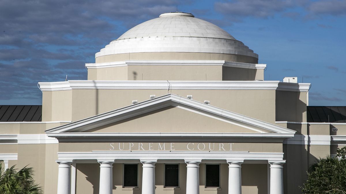 Front of Florida Supreme Court building, deep blue sky in daylight