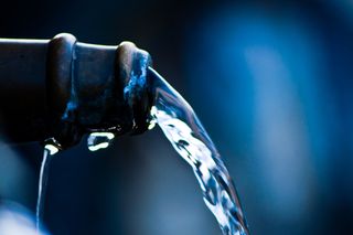 Water running from a faucet.