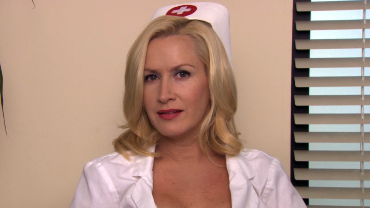 Angela as a nurse talking to the camera on The Office.