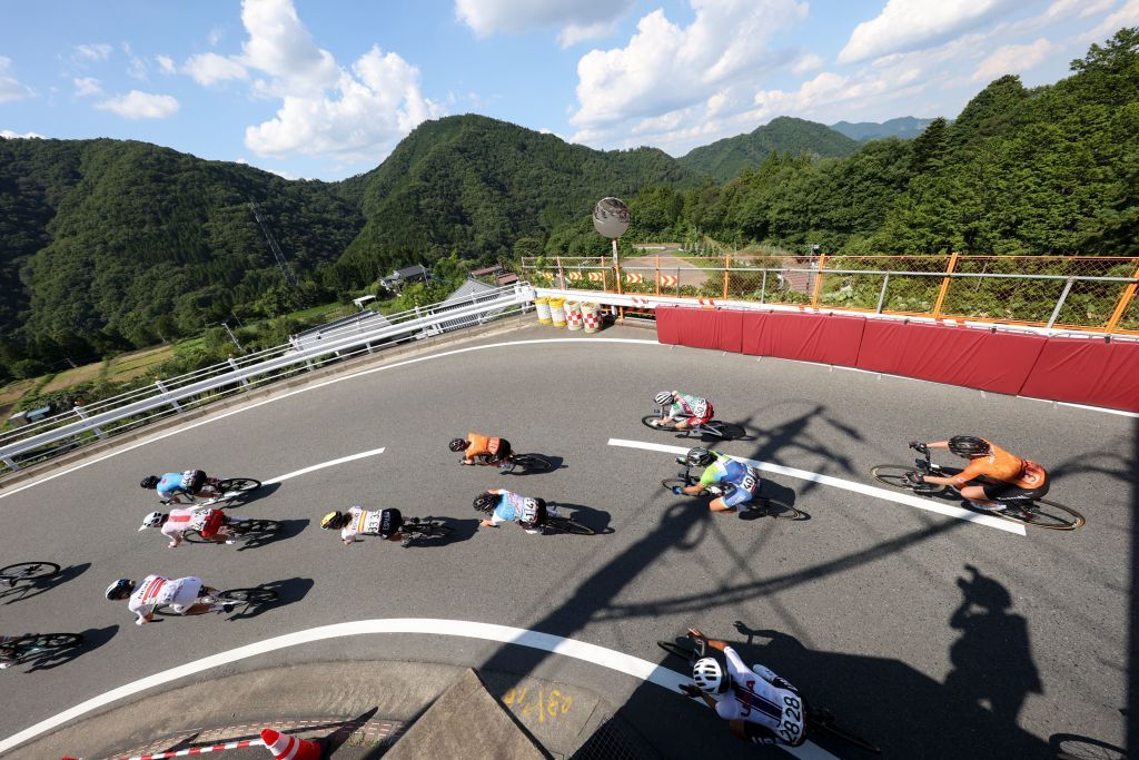 Cyclists take a corner during a descend in the womens cycling road race of the Tokyo 2020 Olympic Games finishing at the Fuji International Speedway in Oyama Japan on July 25 2021 Photo by MICHAEL STEELE various sources AFP Photo by MICHAEL STEELEAFP via Getty Images