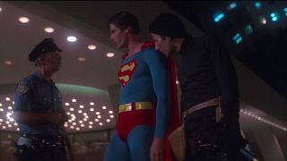 Superman turning over crook to police