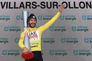 VILLARSSUROLLON SWITZERLAND JUNE 16 Adam Yates of The United Kingdom and UAE Team Emirates celebrates at podium as Yellow leader jersey winner during the 87th Tour de Suisse 2024 Stage 8 a 157km individual time trial stage from Aigle to VillarssurOllon 1249m UCIWT on June 16 2024 in VillarssurOllon Switzerland Photo by Tim de WaeleGetty Images