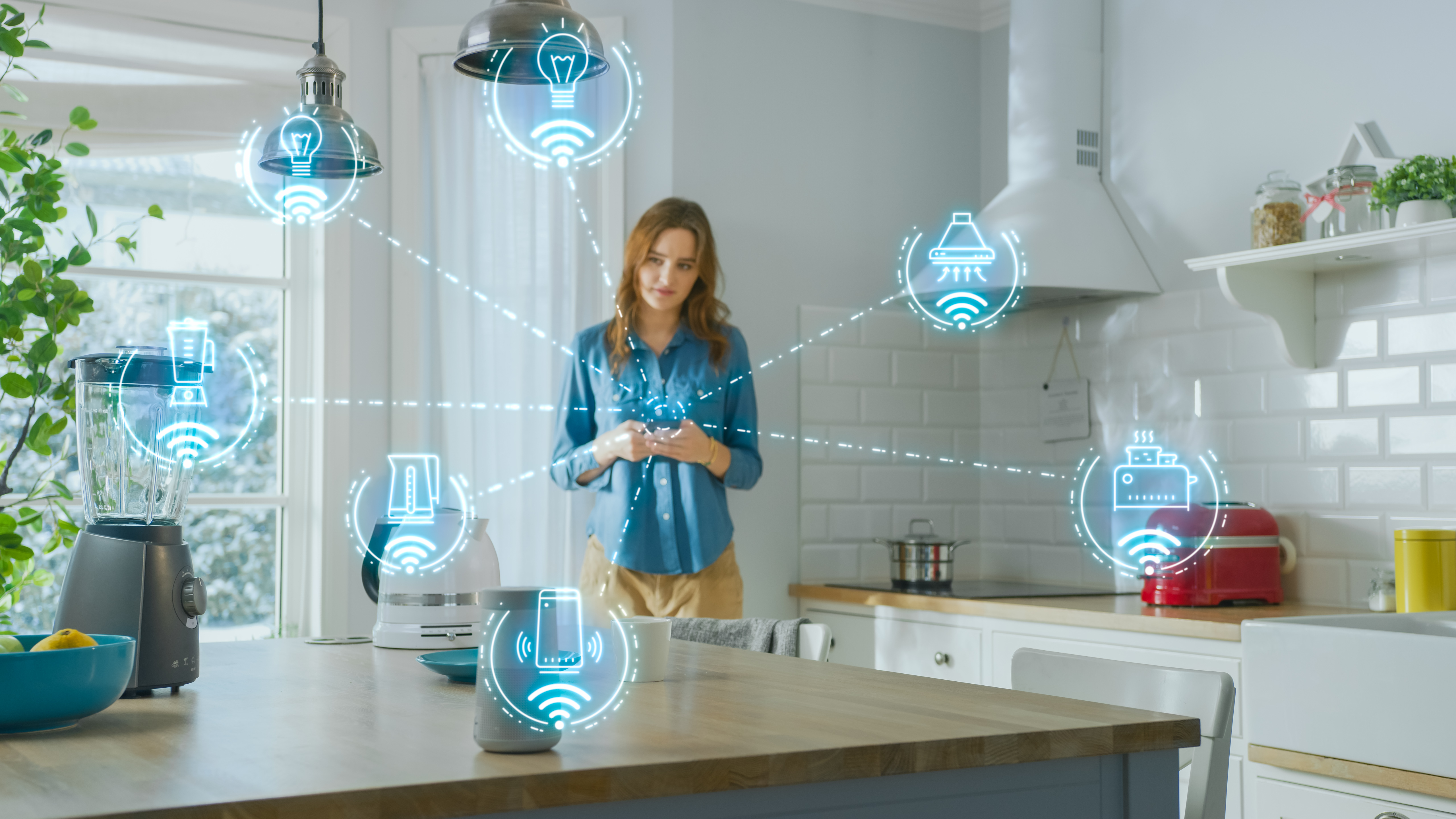 Woman in the kitchen with smart home appliances