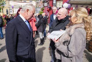 Letitia Dean gives The Prince of Wales a signed Albert Square sign