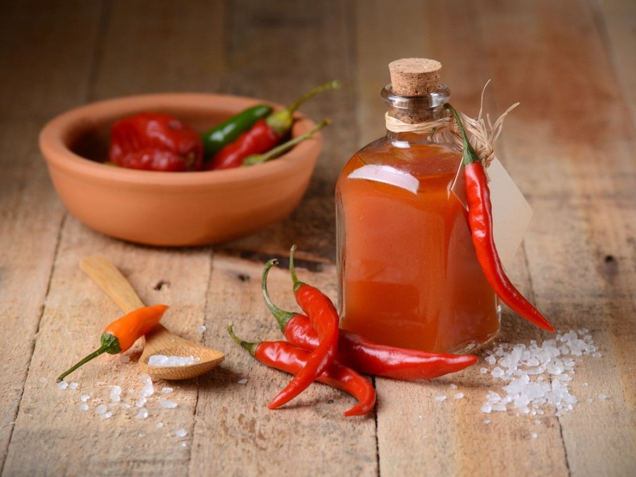 Tabasco Chili Peppers Next To Pepper Sauce