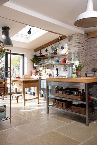 open plan country kitchen extension with rooflights and bi-fold doors, and two islands