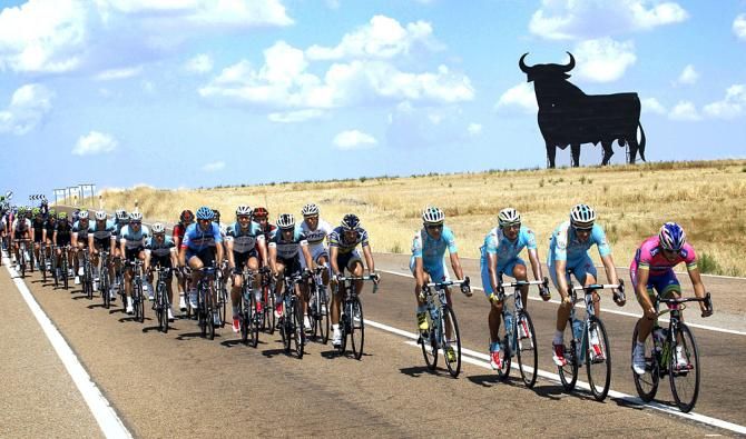 The Vuelta a Espana peloton passes the big bull