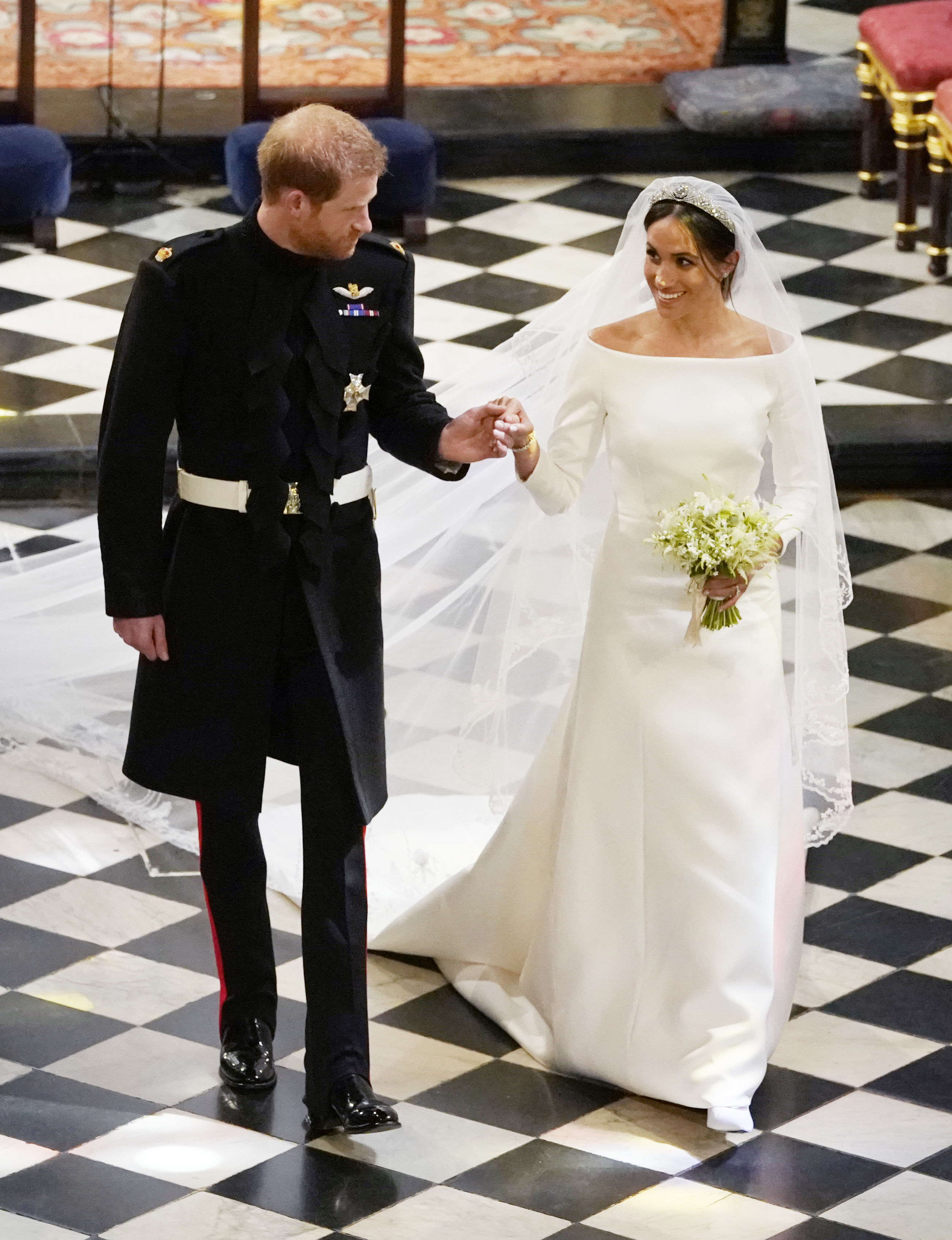 Meghan Markle and Prince Harry on their wedding day walking down the aisle