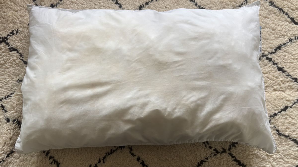 Pillow after being washed with detergent and soda crystals in washing machine.