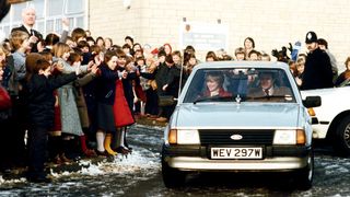 tetbury, united kingdom december 08 princess diana driving her ford escort car on leaving st marys primary school in tetbury bodyguard graham smith in the passenger seat photo by tim graham photo library via getty images