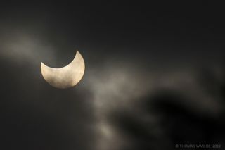 the sun is partially covered by the shadow of the moon