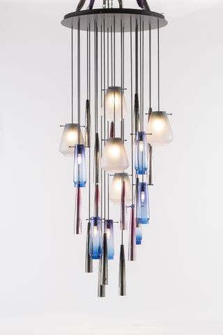 A chandelier by Ini Archibong made of metal cones and colourful glass
