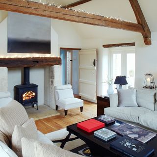 attic white living room with wooden floor and fire place