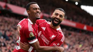 Ryan Gravenberch of Liverpool celebrates scoring his team's first goal with teammate Mohamed Salah during the Premier League match between Liverpool and Everton at Anfield on September 20, 2025 in Liverpool, England.