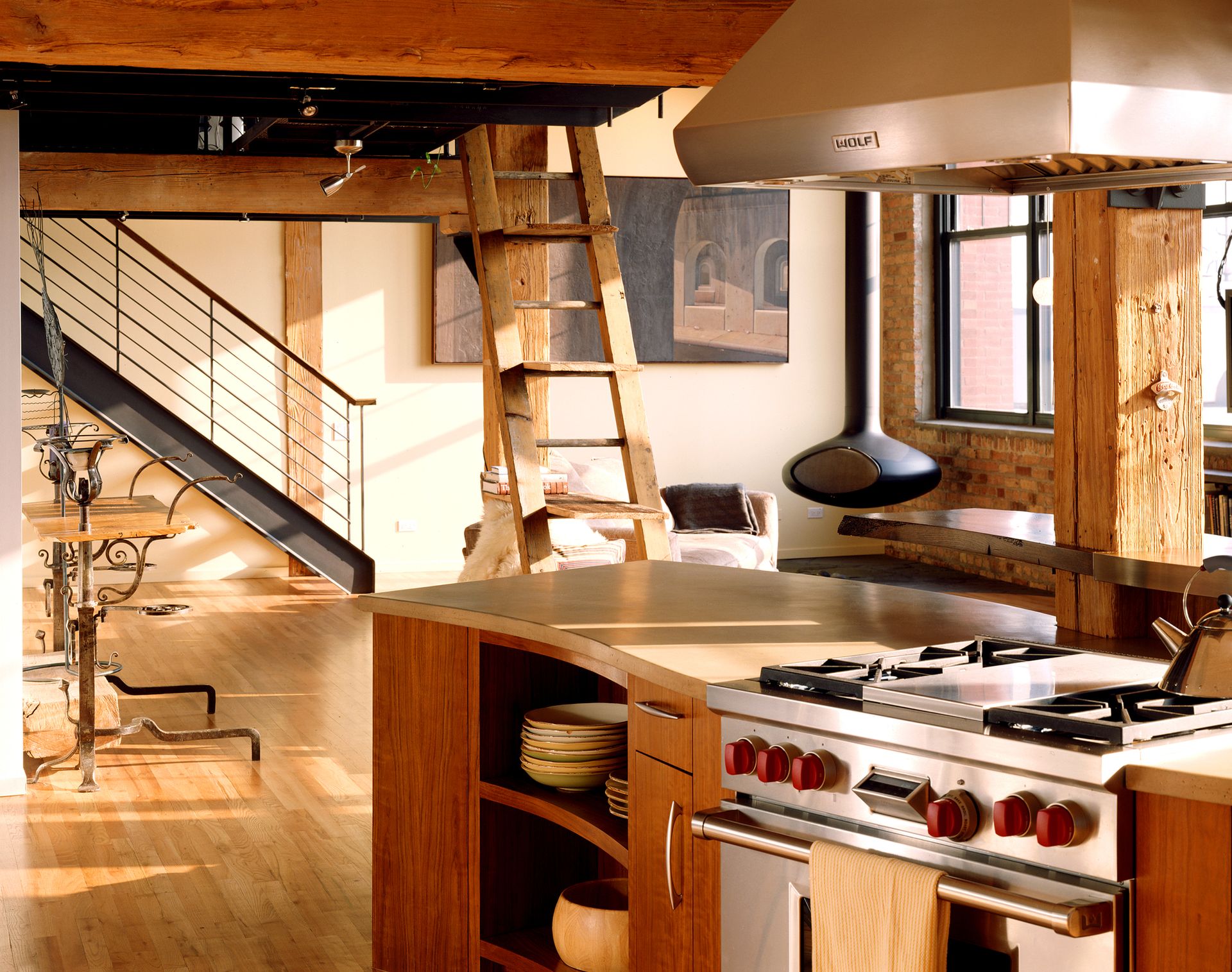 A mid-century modern kitchen design with stainless steel countertop