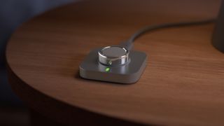 Oura Ring 4 on a charging puck