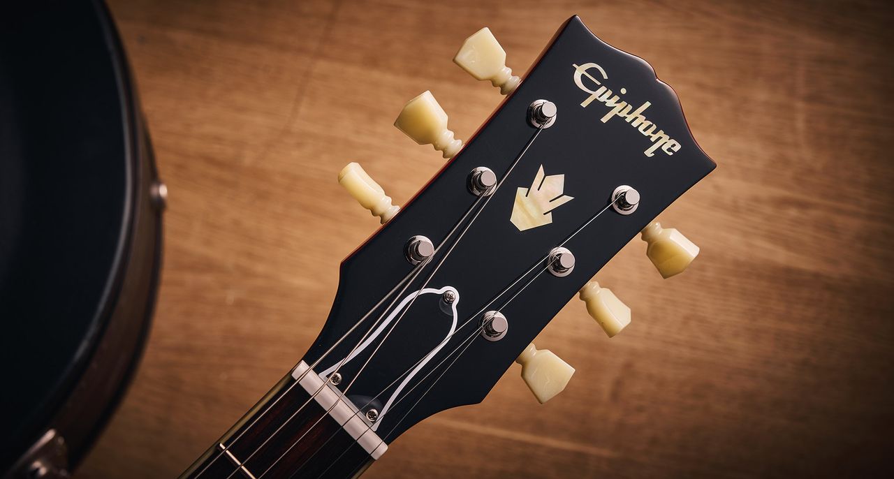 Epiphone Inspired By Gibson Custom 1962 ES-335 Reissue: the handsome semi-hollow electric is finished in Sixties Cherry and is photographed against various backgrounds.
