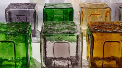 Glass stools of multiple colours by 6AM at the Bottega Veneta runway show
