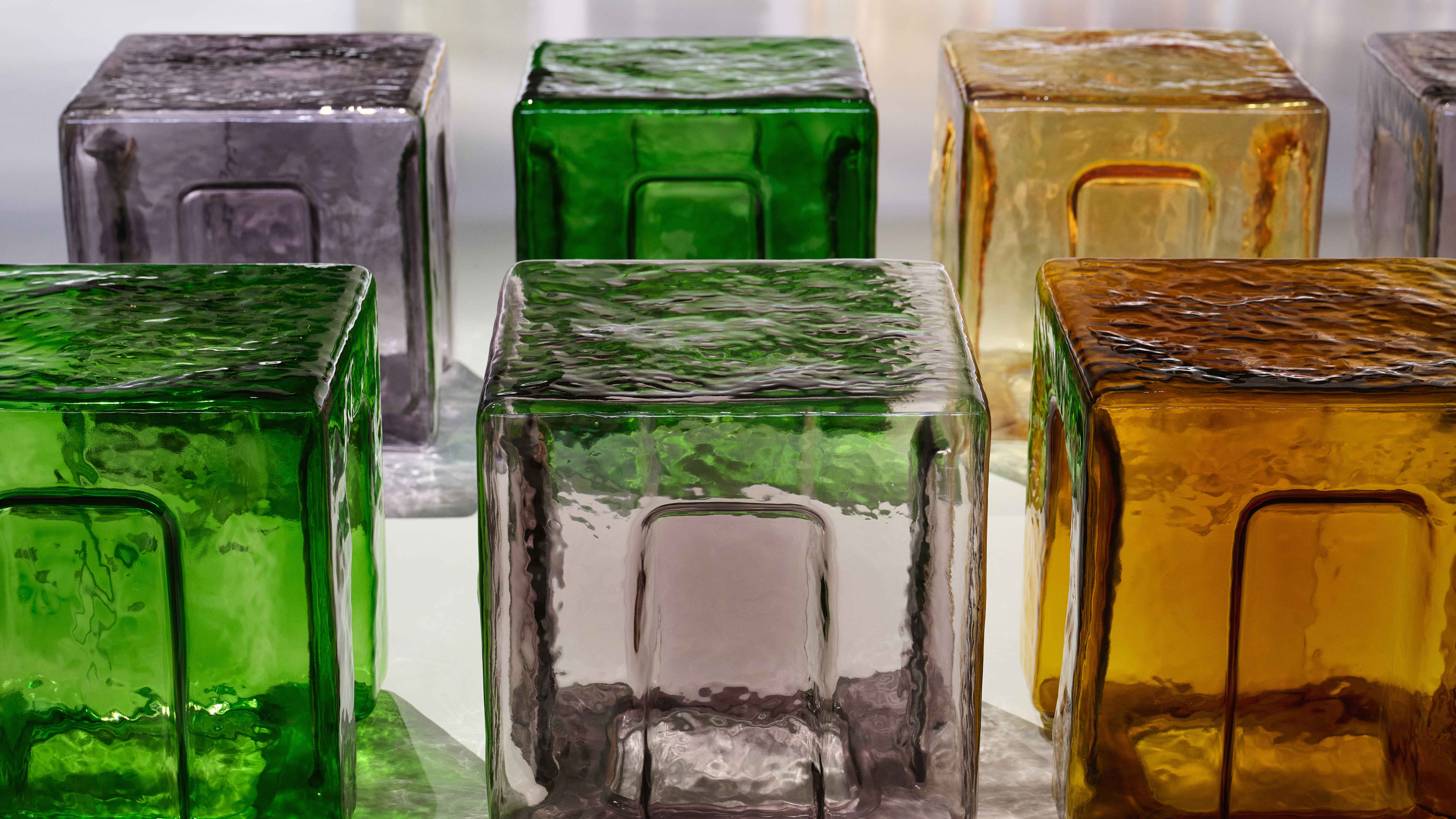 Glass stools of multiple colours by 6AM at the Bottega Veneta runway show