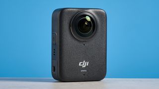 The DJI Osmo 360 against a blue background