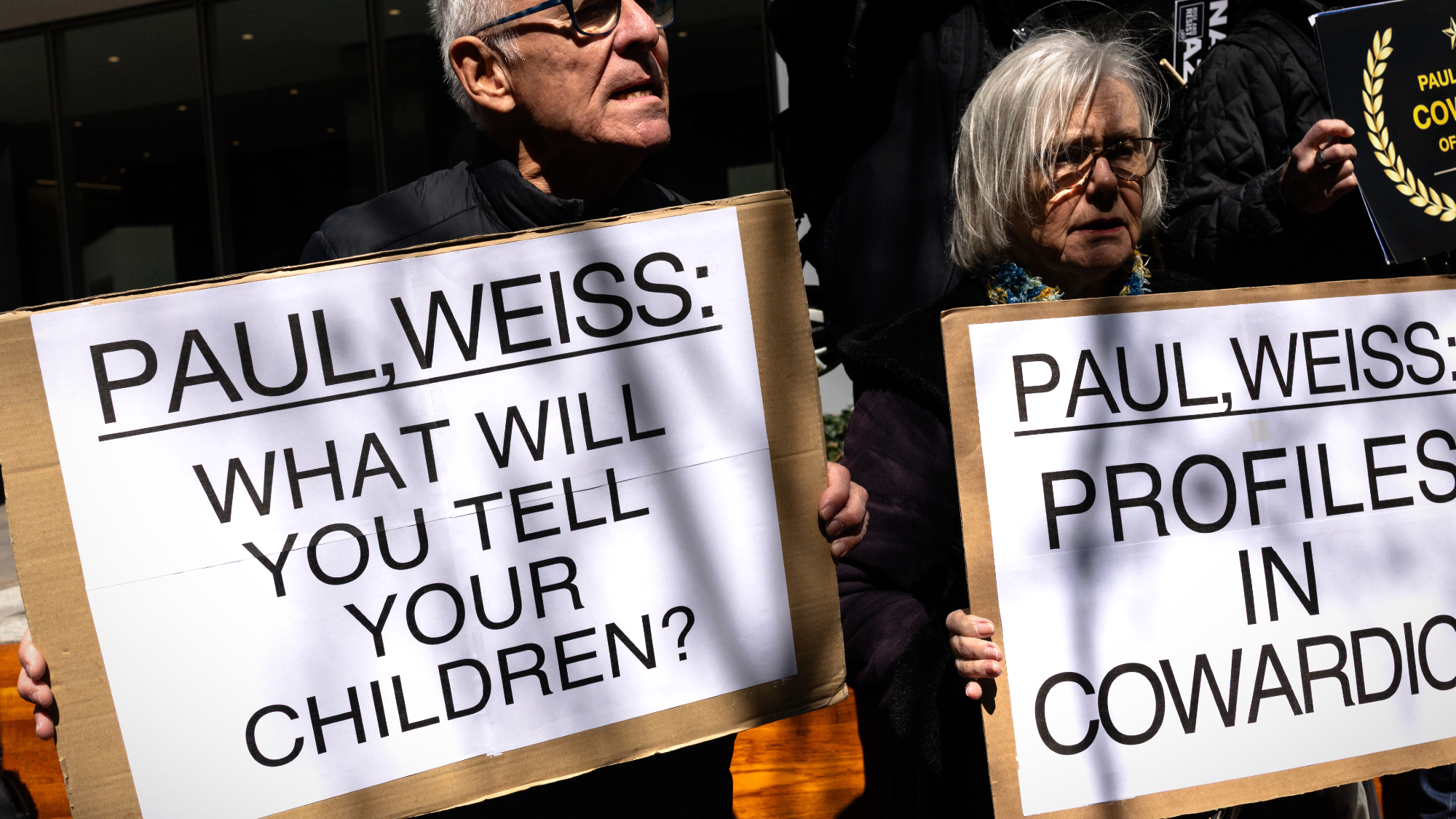 Protesters oppose Paul Weiss deal with President Donald Trump